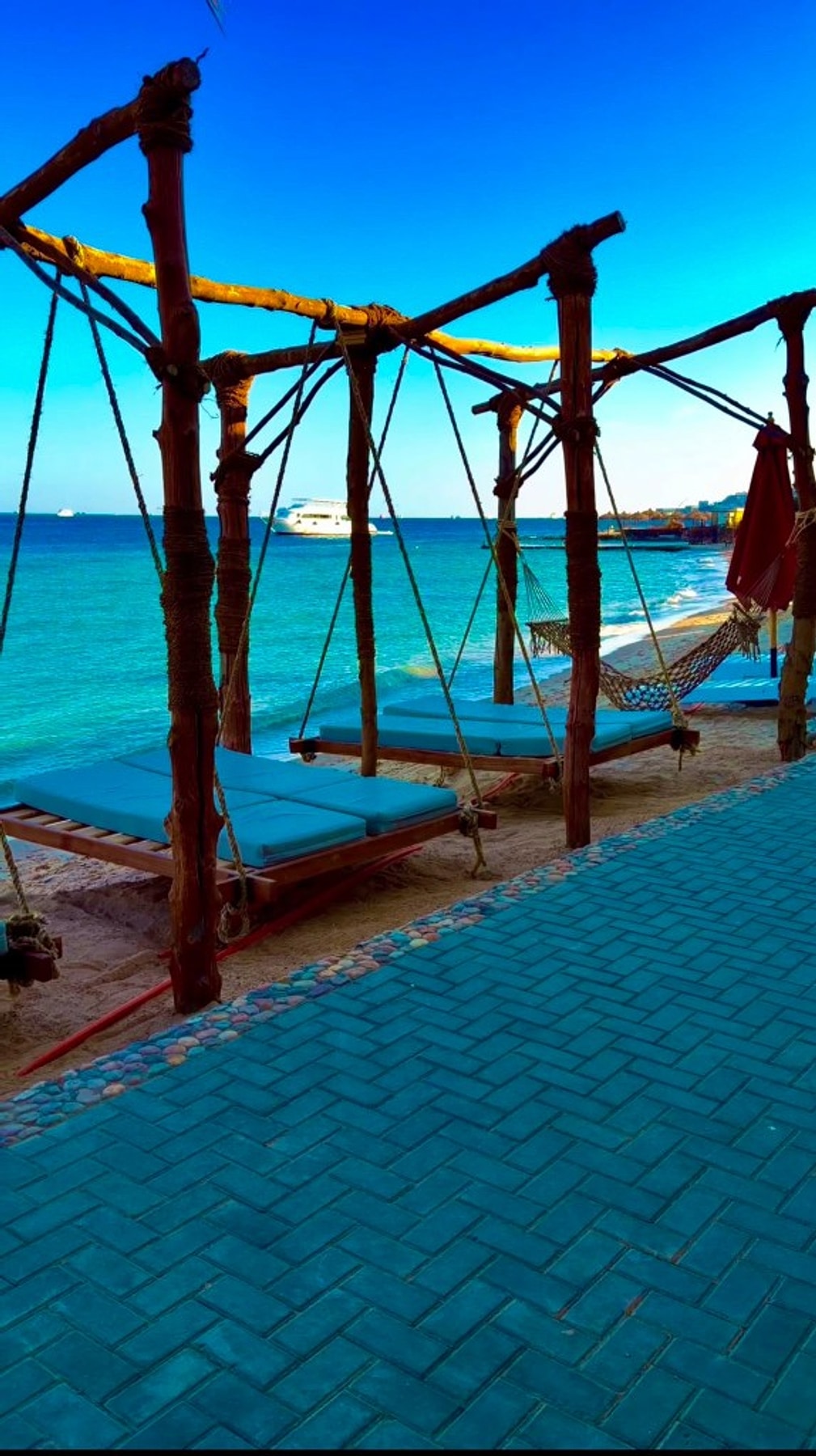 Hanging daybeds on the beach