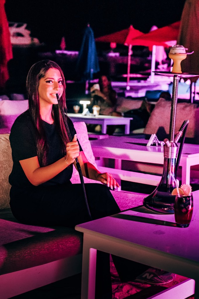 Guest enjoying shisha on the night terrace at Mamma Mia